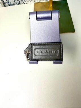 COACH dark gray leather hang tag 1 in H x 2.5 in L